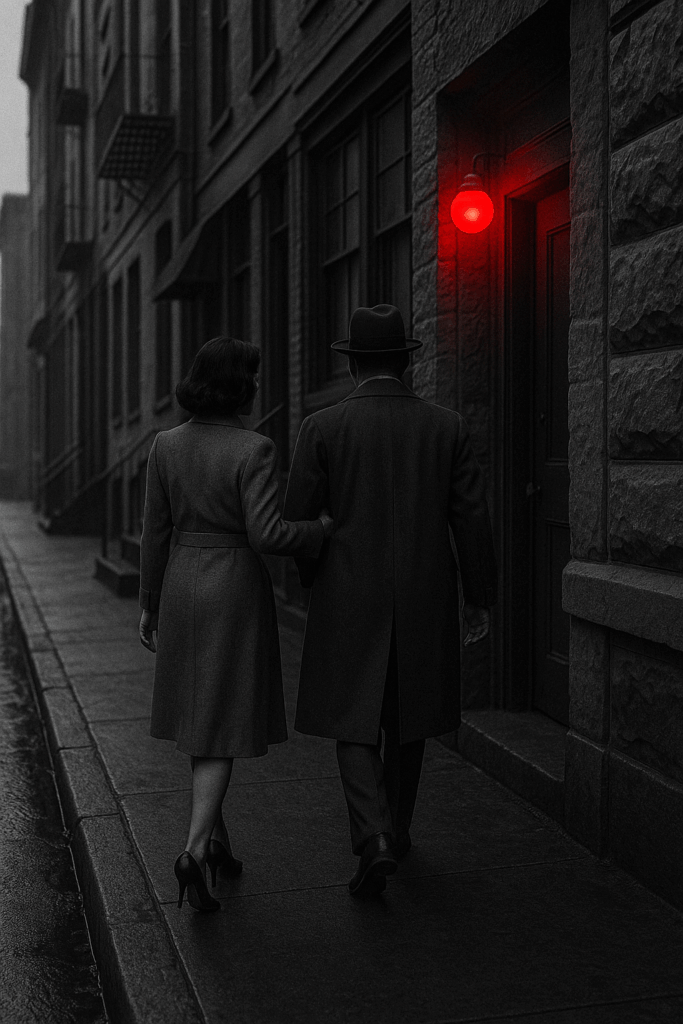 A woman leading a man into a room with a red light on the door.
